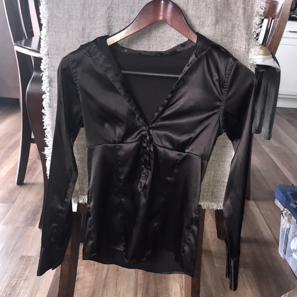 Zara basic half button up top.                          Polyester and spandex.